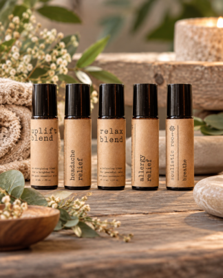 Essential oil roller gift set with five aromatherapy blends in a rustic spa setting