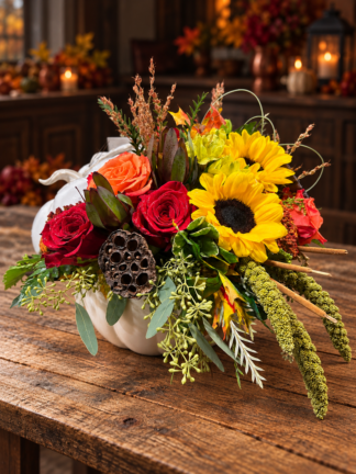 A White pumpkin cookie jar with lovely fall flowers ready to be delivered.