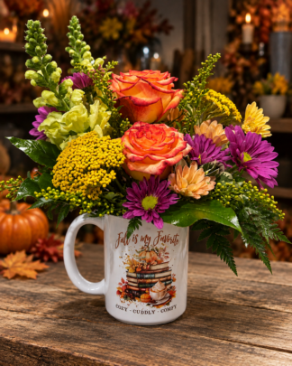 Autumn's Favorite Things Mug & Flowers featuring orange roses, purple chrysanthemums, golden autumn blooms and greenery in a fall keepsake mug from Aggieland Flowers & Chocolates.